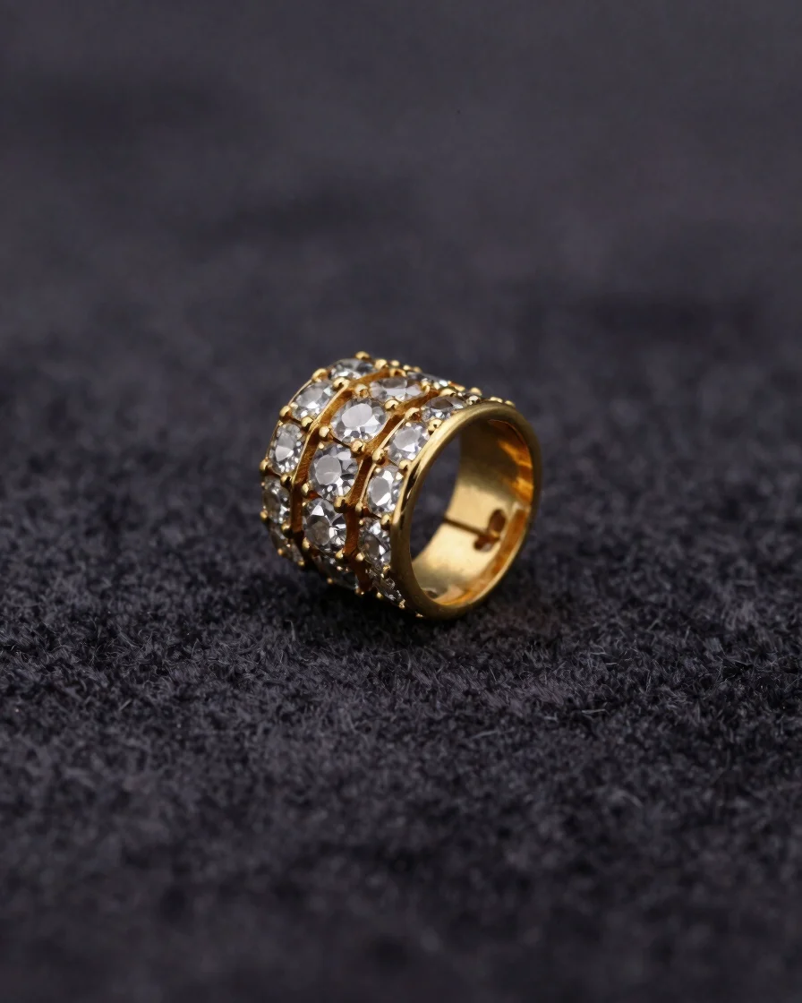 Macro editorial photograph of gold and silver cladding beside precision-cut stones on a dark velvet ground, soft directi